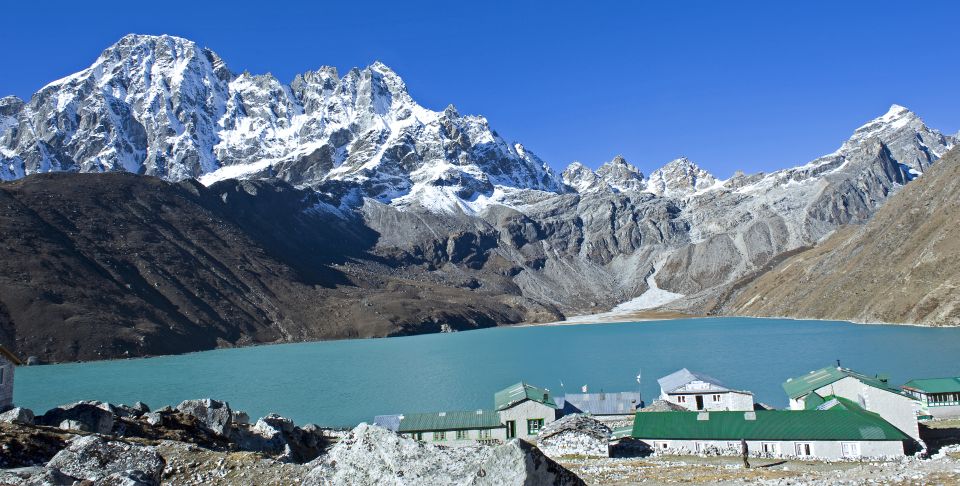 Pharilapche Peak ( 6017m ) and Renjo La ( 5345m ) across Gokyo Lake from Gokyo Village