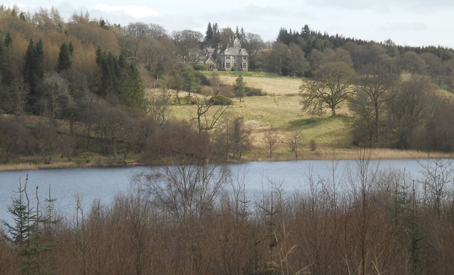 Craigallian House across Craigallian Loch from the West Highland Way