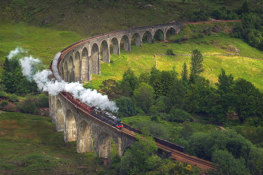 Steam Train on Glenfinnan Viaduct in Lochaber in Western Scotland