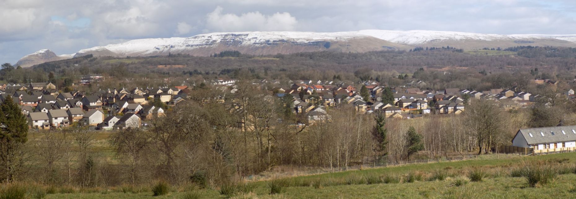 Campsie Fells beyond Mains Estate from trig point on South Mains Farm